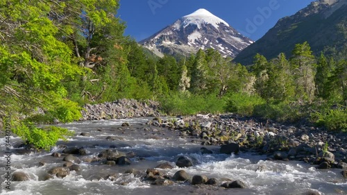 Lanin volcano in Lanin national park. Landscape with volcano, mountain river and green trees. Argentina, Patagonia, Lake district photo