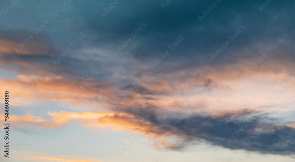 Beautiful bright sunset sky.  Dramatic colorful clouds after sunset. Nature backgrounds
