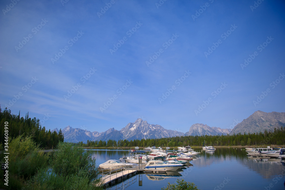 lake and mountains, boats on the water, Jenny Lake, Montana Lake