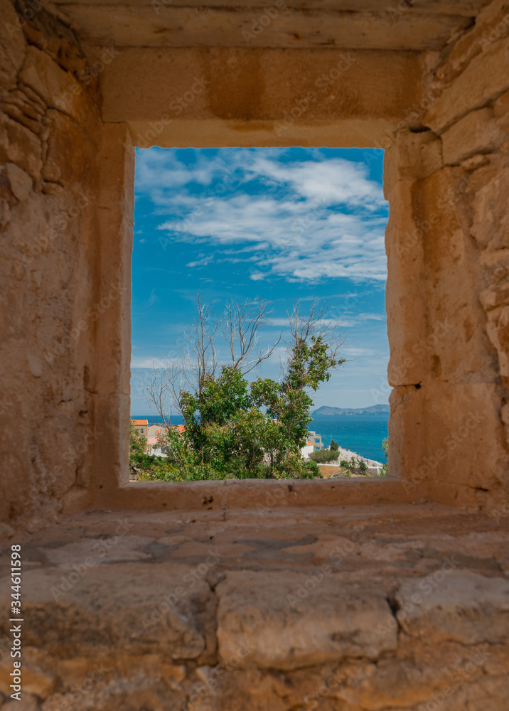 view of the sea through the window in the castle