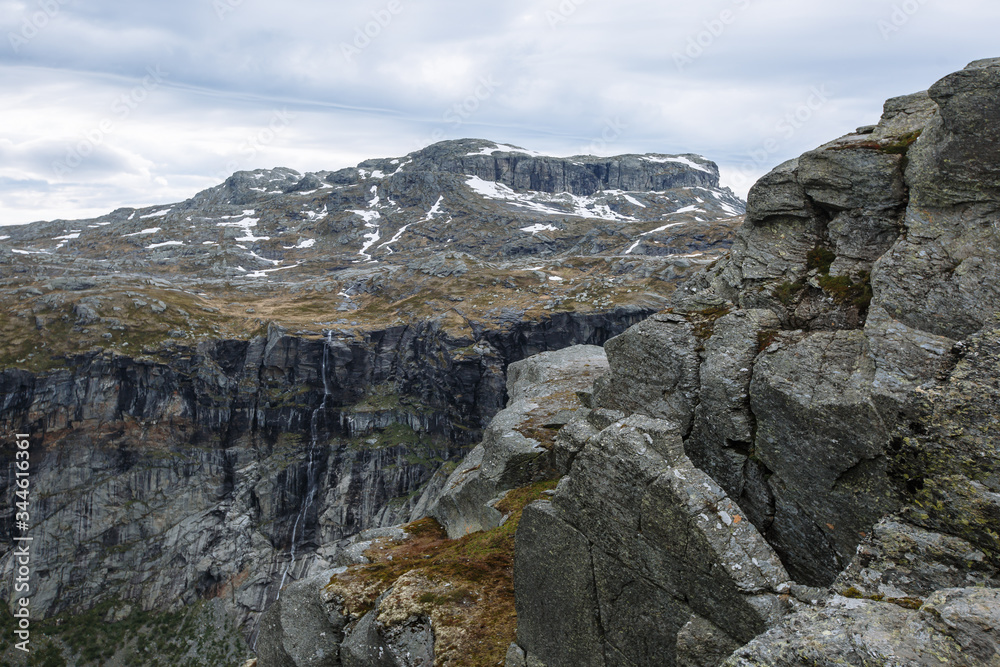 Norwegian landscape with a view of the fjord from a rock fragment Troll's tongue