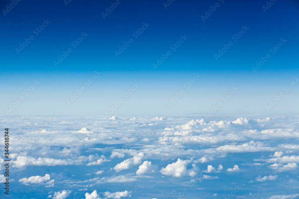 Clouds top view of the airplane. Heavenly landscape.