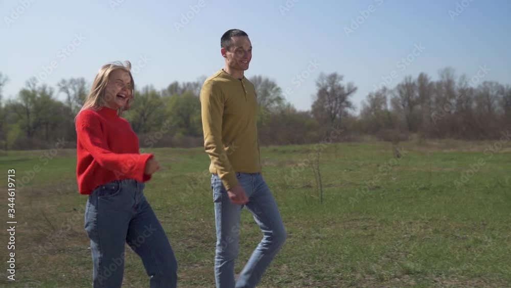 heterosexual couple walks along and runs away
heterosexual couple walks along and runs away