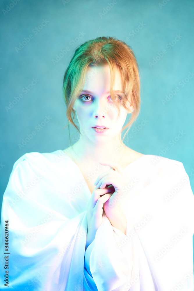 Studio portrait of a bright beautiful girl. Bright portrait in white Studio portrait of a bright beautiful girl. Bright portrait in white