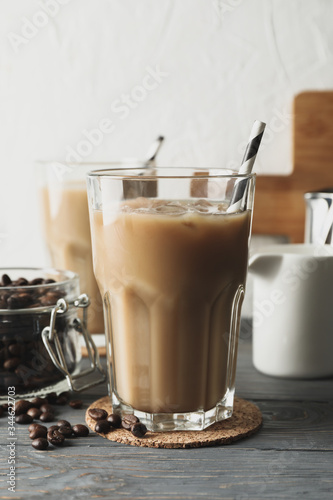 Composition with glasses of ice coffee on wooden background
