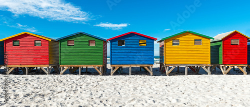 Panorama of the colorful Muizenberg Beach Huts, Cape Town, South Africa.