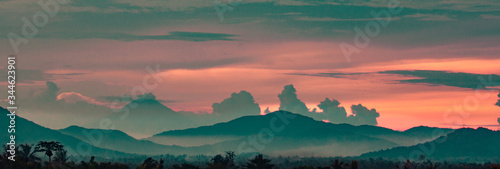 sunrise view at the village with background mountain