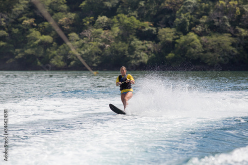 Female wake boarding in Costa Rica.