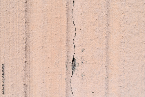 Poured exterior concrete wall with large crack