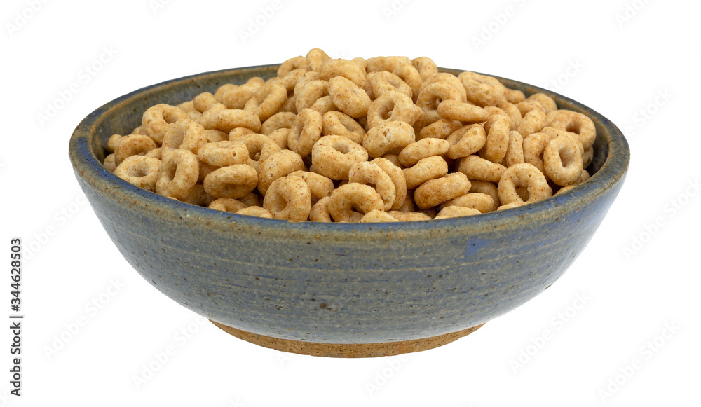 Generic round whole grain oat cereal in a stoneware bowl Generic round whole grain oat cereal in a stoneware bowl
