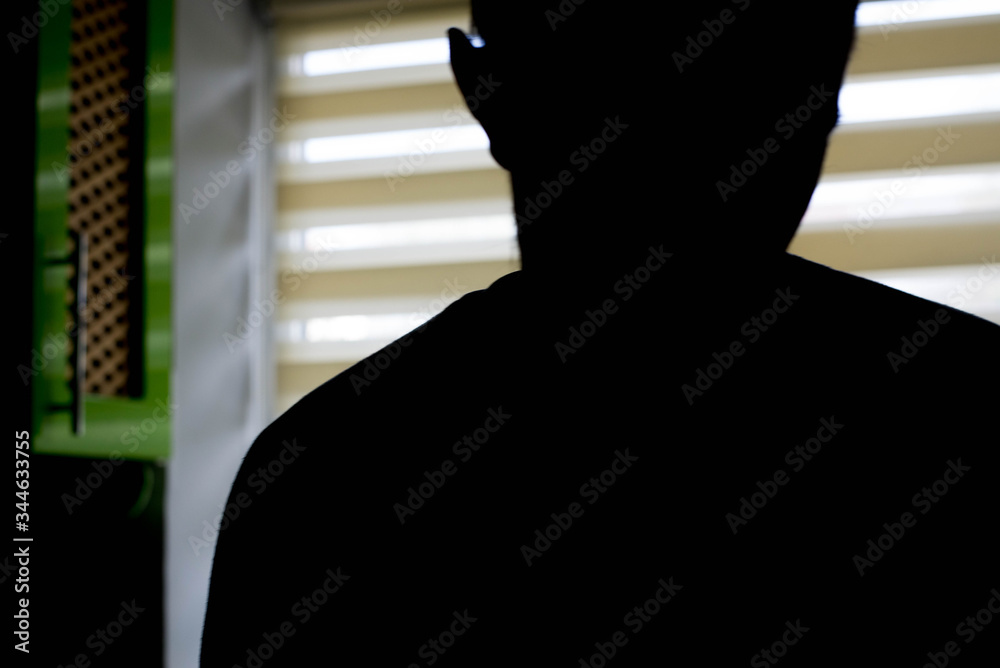 Silhouette of a man in the dark
