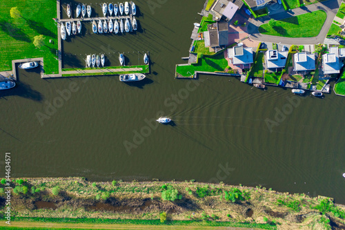 Aerial drone top-down photo of Sailboats passing from a canal above an aqua duct in the Netherlands