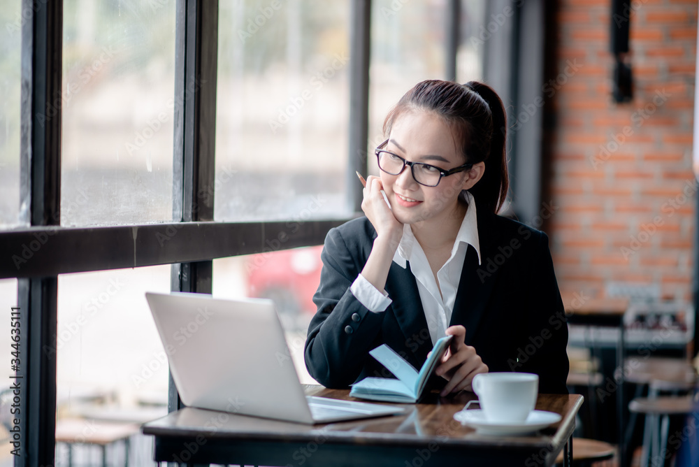 Businessman analyzing and recording information about financial business Businessman analyzing and recording information about financial business