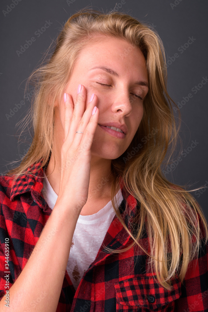 Face of young blond hipster woman with eyes closed Face of young blond hipster woman with eyes closed