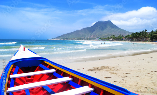 Colorful boats on one of the beautiful beaches of the Isla de Margarita, Venezuela. photo