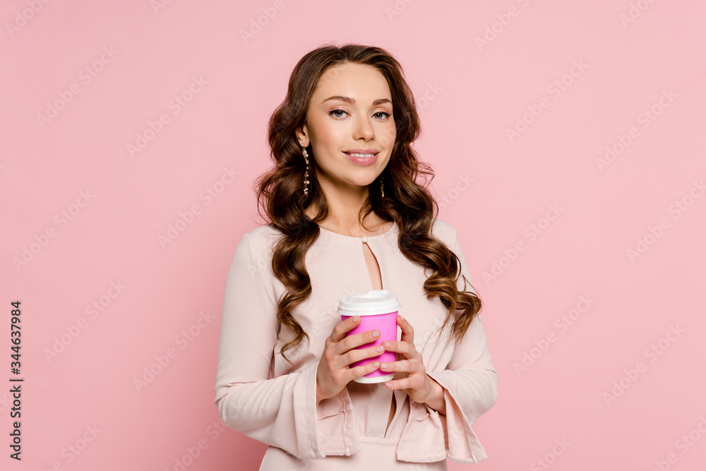 happy young woman holding paper cup isolated on pink happy young woman holding paper cup isolated on pink