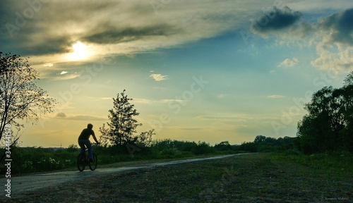 silhouette of a man walking on a hill