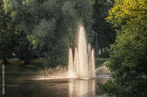 river fountain in the park on a summer evening