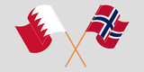 Crossed and waving flags of Bahrain and Norway