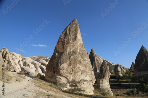 View of valley and rock formations in Cappadocia Turkey. Tuff volcanic cliffs and sandstone hills landscape.