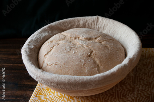 Bread dough loaf raw in proofing basket ,before baking, whole wheat recipe. Rye flour. Home made. photo