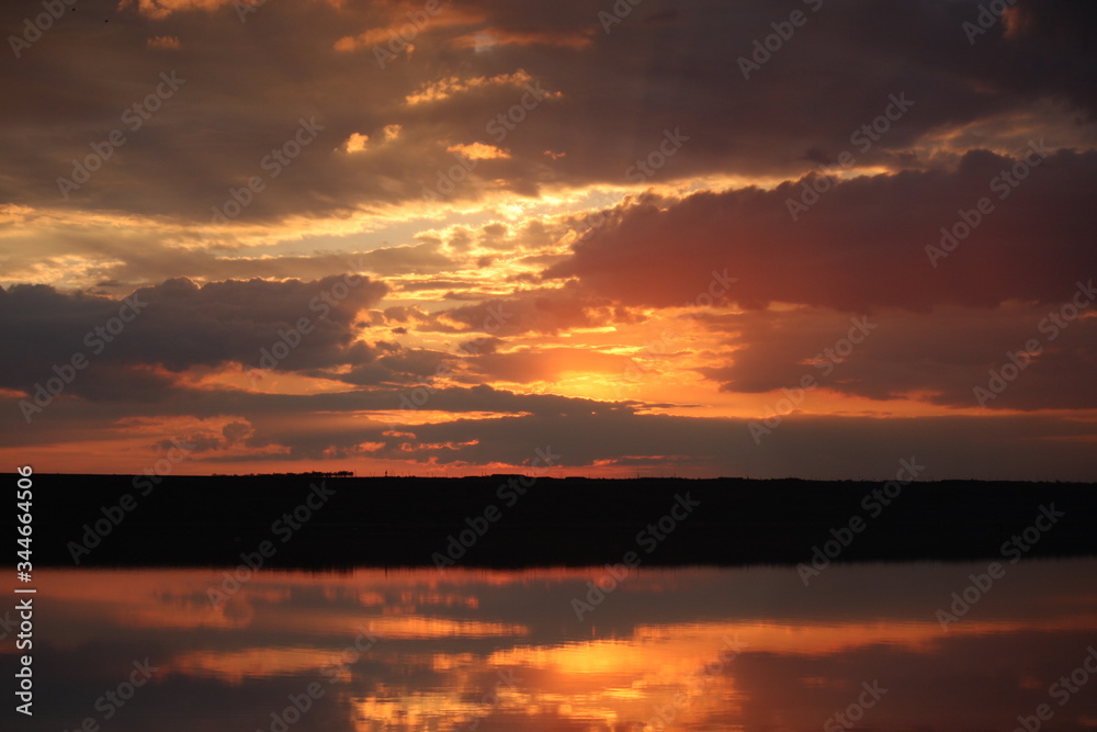 Fototapeta premium fiery sunset on the lake