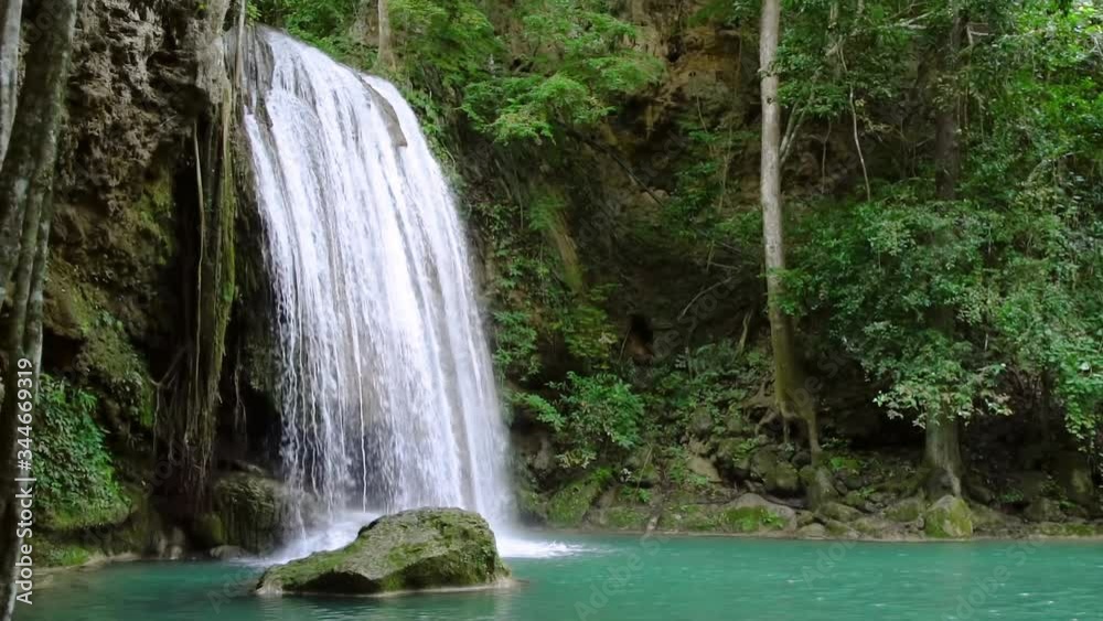 Erawan waterfall third level in National Park, famous tourist destination in Kanchanaburi, Thailand - slow motion Erawan waterfall third level in National Park, famous tourist destination in Kanchanaburi, Thailand - slow motion