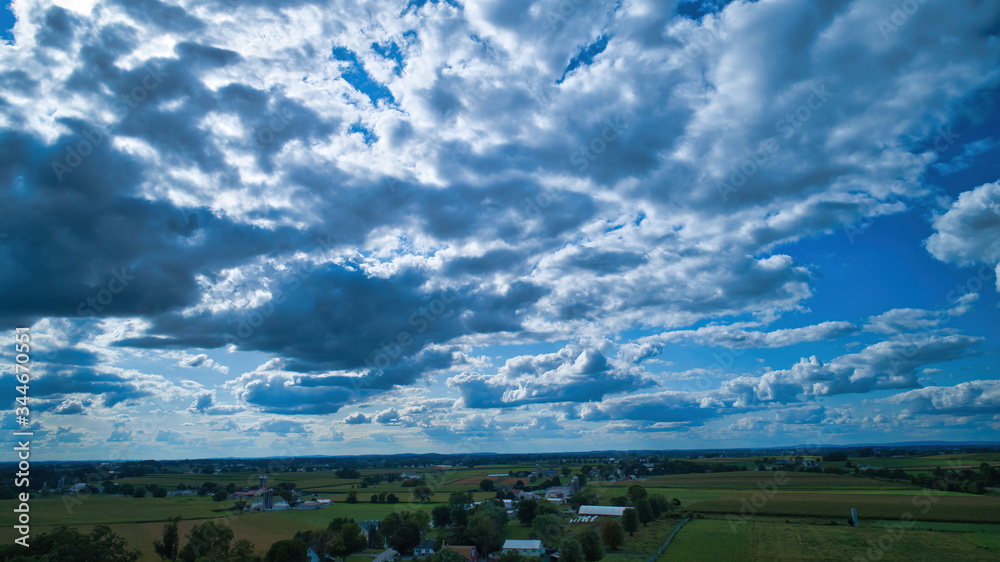 Blue sky and multiple clouds background showing a horizon Blue sky and multiple clouds background showing a horizon