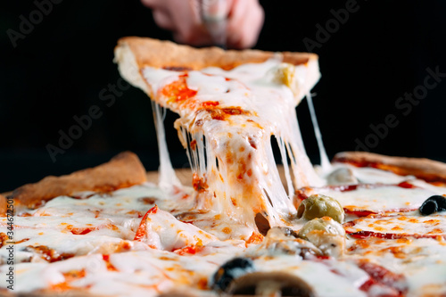 Canvas-taulu Pizza with very much cheese melting.