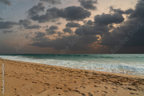 Ocean sunset evening beach with cloudy sky, Sri Lanka