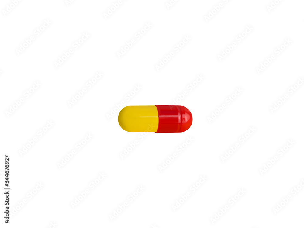 Drug. Capsule, tablet of red and yellow color isolated on a white background. Medicine, pharmaceutical Drug. Capsule, tablet of red and yellow color isolated on a white background. Medicine, pharmaceutical