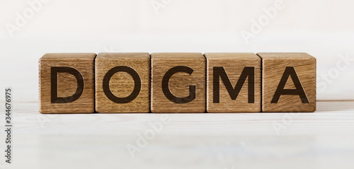 Photography DOGMA word concept written on a light table and light background