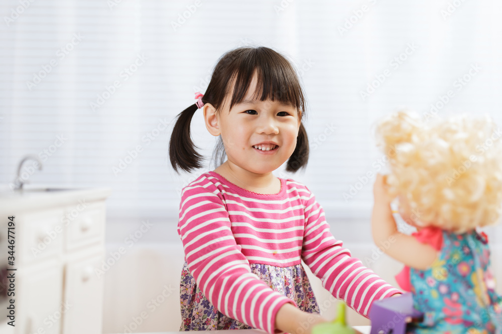 toddler girl pretend play feeding baby at home toddler girl pretend play feeding baby at home