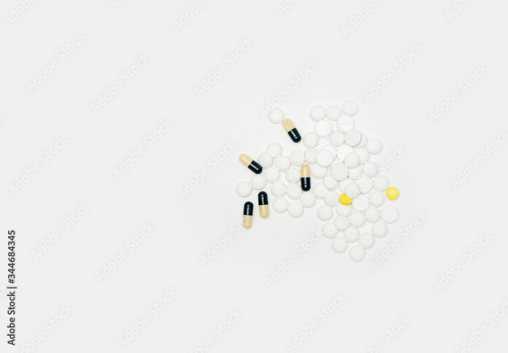 different pills on a white background. top view.