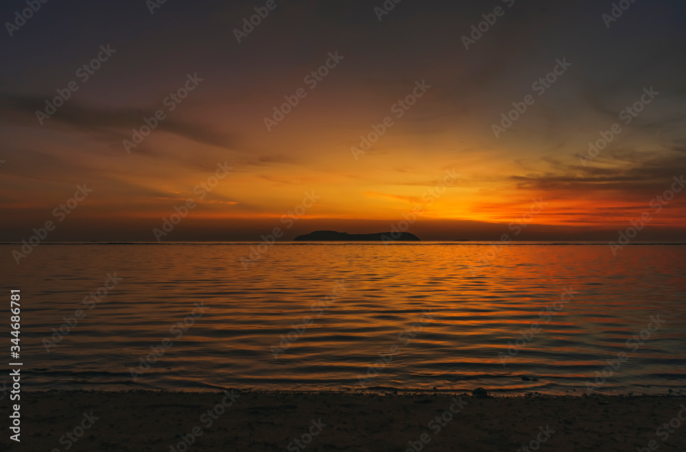 Magical remarkable sunset or sunrise scene with famous Rhun island in distance far away in the horizon spice islands