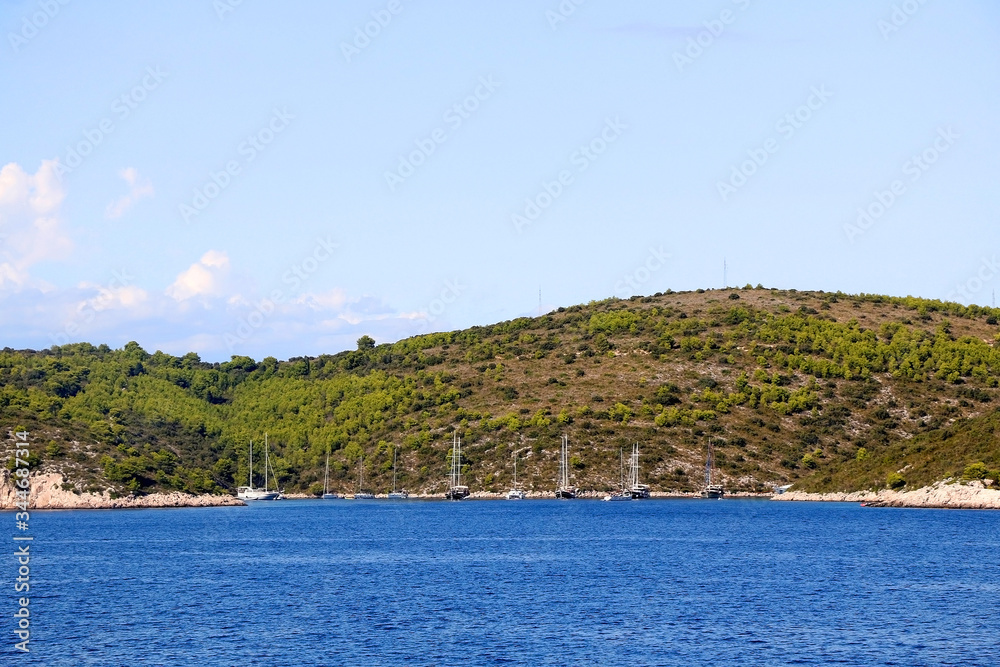Sailing boat on the sea in southern Dalmatia region in Croatia. Beautiful landscape and bright summer day. Sailing boat on the sea in southern Dalmatia region in Croatia. Beautiful landscape and bright summer day.
