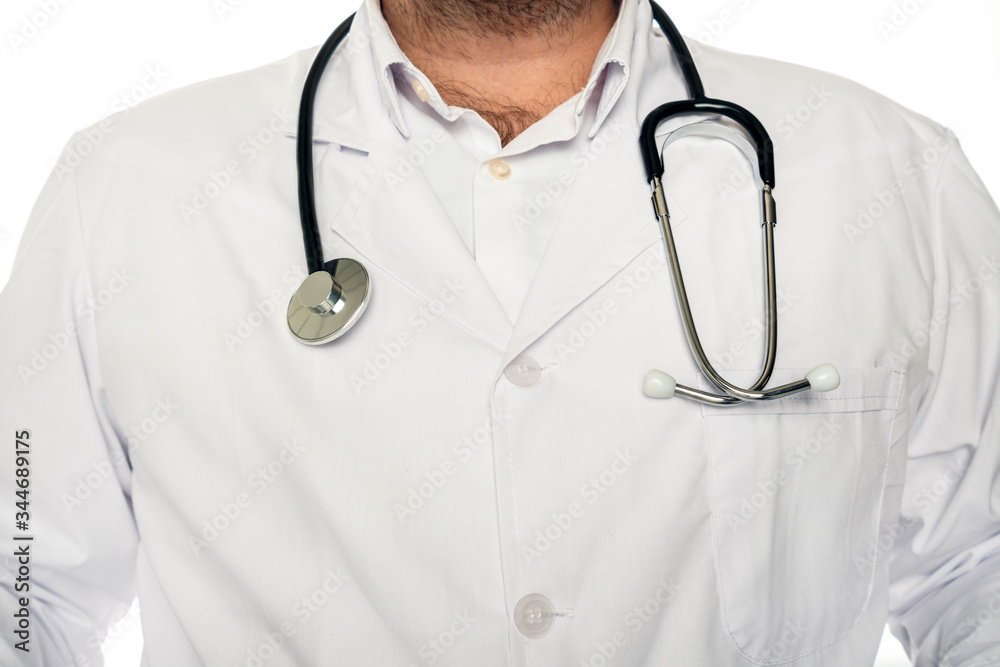 Doctor with lab coat and stethoscope isolated on white background in hospital. Doctor with lab coat and stethoscope isolated on white background in hospital.