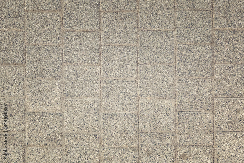 Fototapeta premium Toned photo of stone paving slabs. Dirty gray background for sites and layouts
