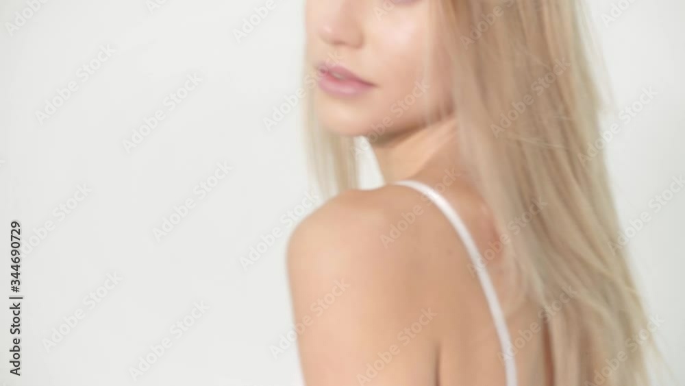 Realtime motion girl posing in perfect white studio in nice shorts and sexy style with wind Realtime motion girl posing in perfect white studio in nice shorts and sexy style with wind