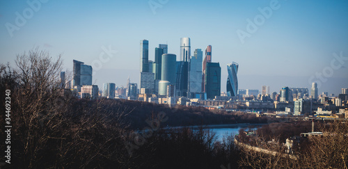 Sunny super-wide angle view from Sparrow Hills (Vorobyovy Gory), Moscow, Russia, with Luzhniki Stadium, Moscow cable car ropeway gondola, and scenery panorama beyond the city
