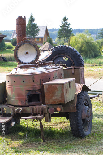 Demonstration show of times of war. Old rusty military equipment. Field kitchen, where they prepare food for the fighters.