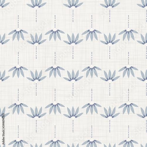 Seamless tossed floral pattern in french blue linen shabby chic style. Hand drawn country bloom texture. Rustic woven background. Kitchen towel home decor swatch. Simple flower motif all over print