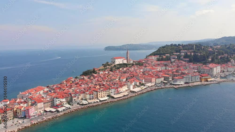 Flight over Piran in Slovenia, St. George's Parish Church, Tartini Square. Drone aerial shot. Flight over Piran in Slovenia, St. George's Parish Church, Tartini Square. Drone aerial shot.
