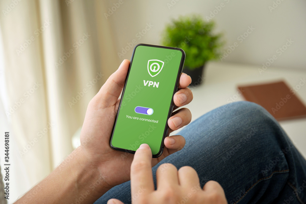 Vpn Using Man Ong Men using VPN on Mobile Stock Photo | Adobe Stock
