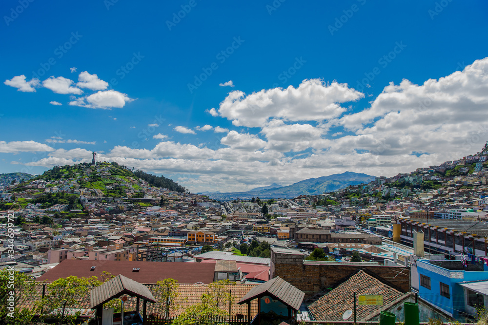 QUITO, ECUADOR, FEBRUARY 02, 2018: High view of the city of Quito and some buildings, with Panecillo hill in the top of the mountain