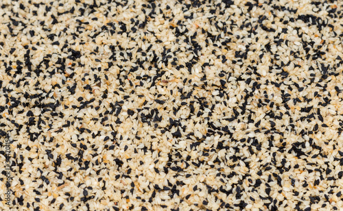 abstract background of fried sesame seeds and caraway seeds © donikz