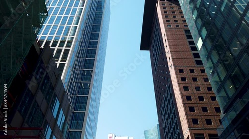 Frankfurt downtown POV looking up on highrises with blue sky