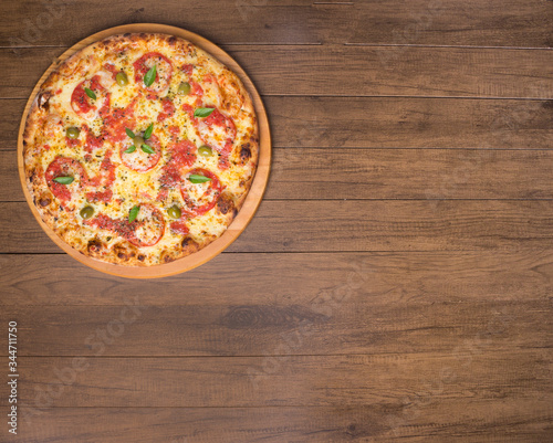 Cuadro en lienzo Pizza Marguerita made with tasty pizza dough, Mozzarella, tomatoes, marjoram and green olives