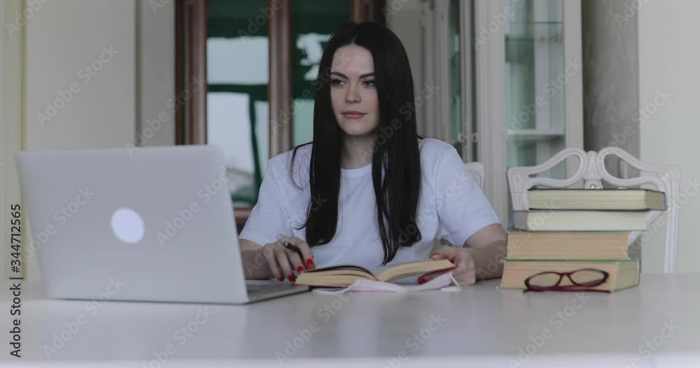 Female student talking on website during remote online studying in home Female student talking on website during remote online studying in home