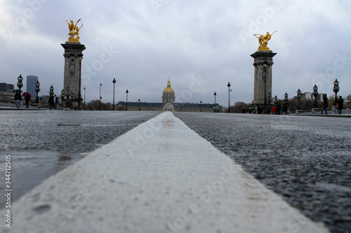 A unique ground-level perspective of Parisian architecture on a rainy day in Paris, France